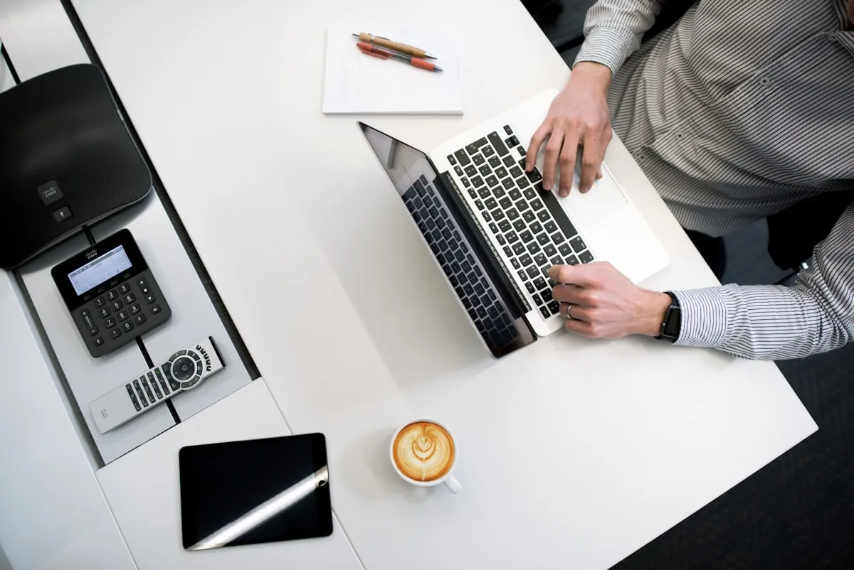 Clean laptop workspace on a white table